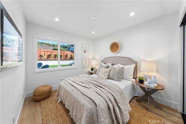 a bedroom with a bed and window