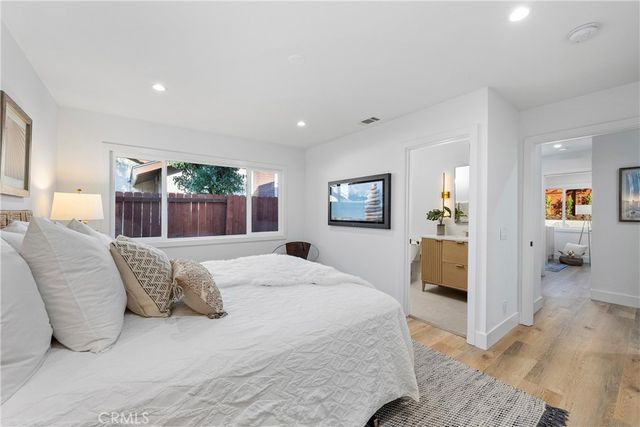 a bedroom with a large bed and a couch