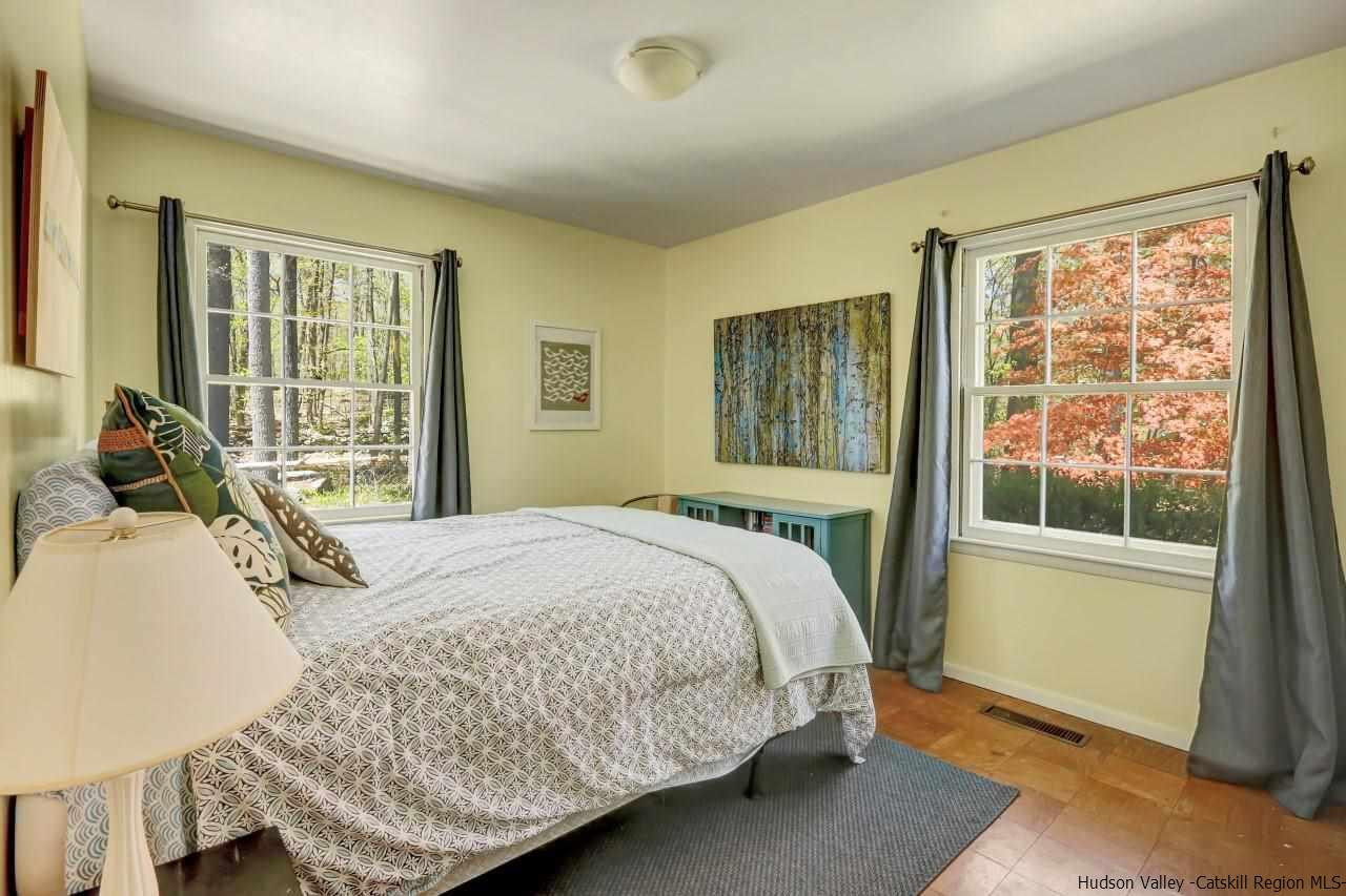 10 Pine Tree Road West Hurley, NY 12491 - Photo 14 of 28 a bedroom with a bed and wooden floor