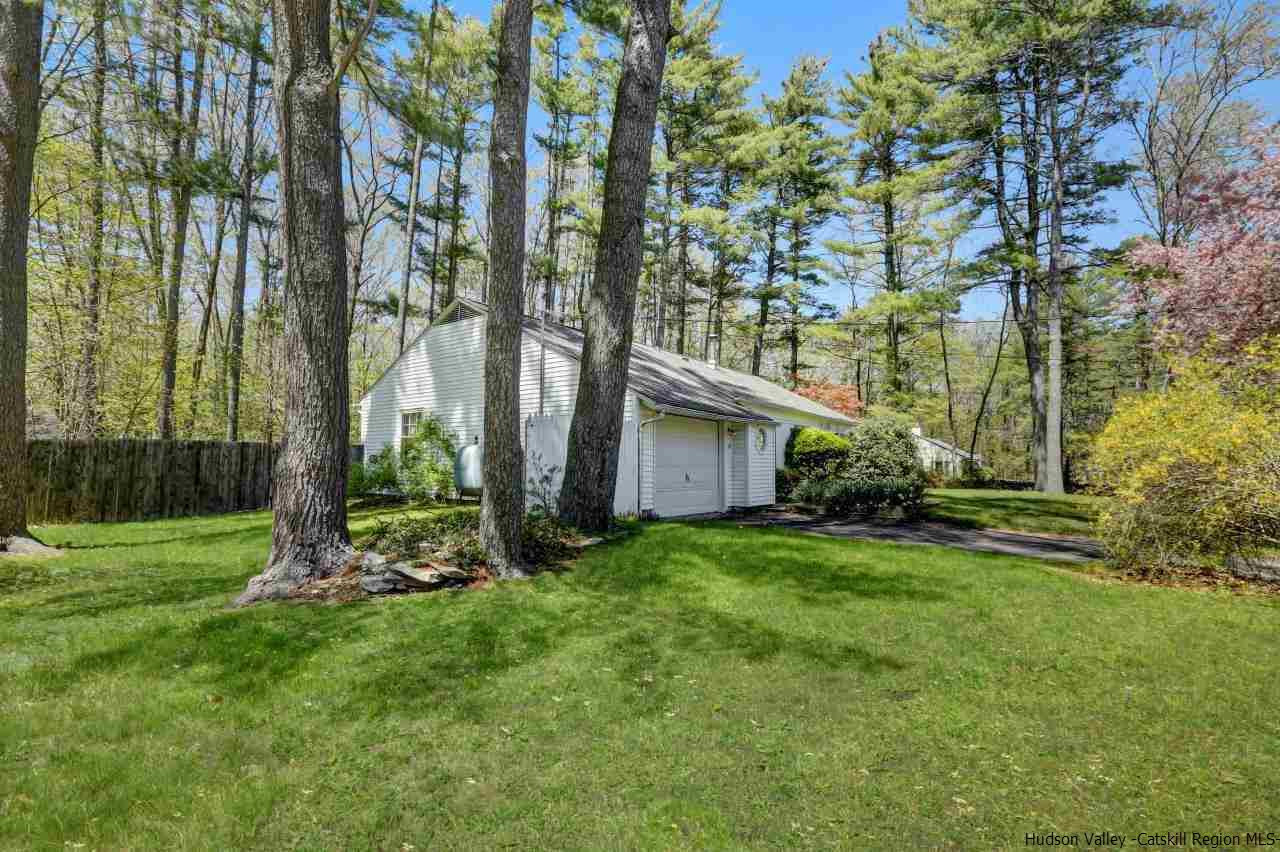 10 Pine Tree Road West Hurley, NY 12491 - Photo 21 of 28 a view of a backyard with plants and large trees