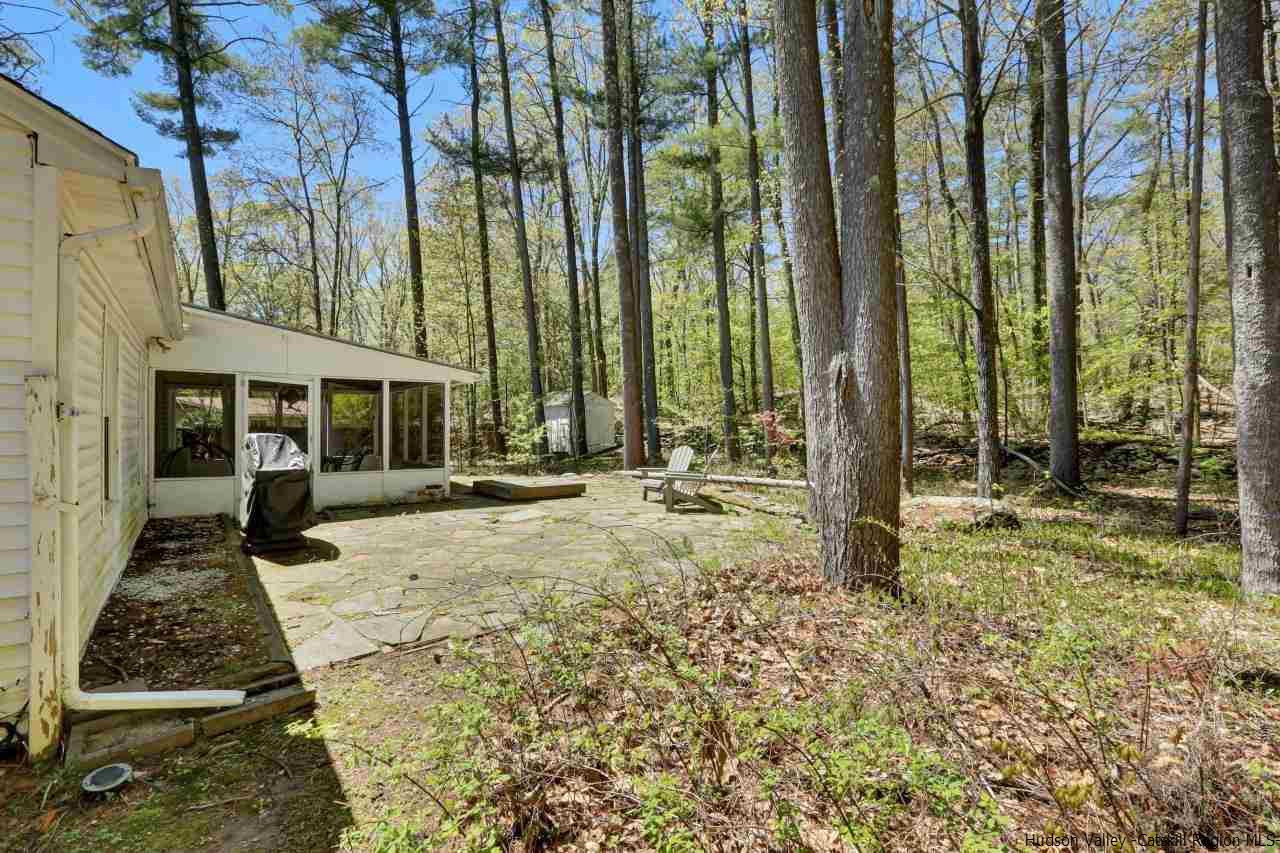 10 Pine Tree Road West Hurley, NY 12491 - Photo 22 of 28 a view of a house with backyard and sitting area