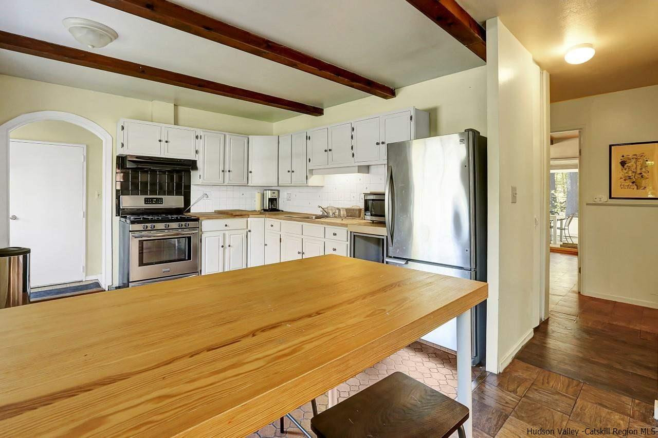 10 Pine Tree Road West Hurley, NY 12491 - Photo 6 of 28 a kitchen with stainless steel appliances a refrigerator and a stove top oven