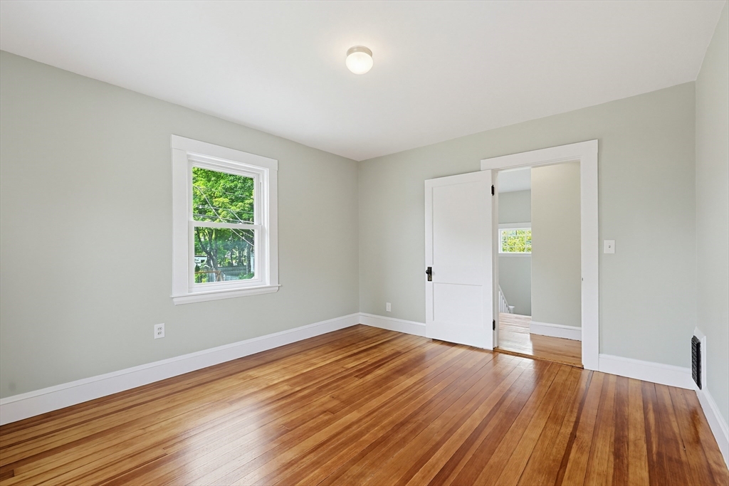 10 Water Street Natick, MA 01760 - Photo 13 of 35 an empty room with wooden floor and windows