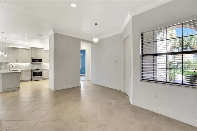 a view of a kitchen with a sink and a window