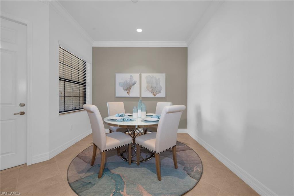 13404 Monticello Boulevard Naples, FL 34109 - Photo 10 of 23 Light-filled dining area with neutral finishes and an open, airy feel.