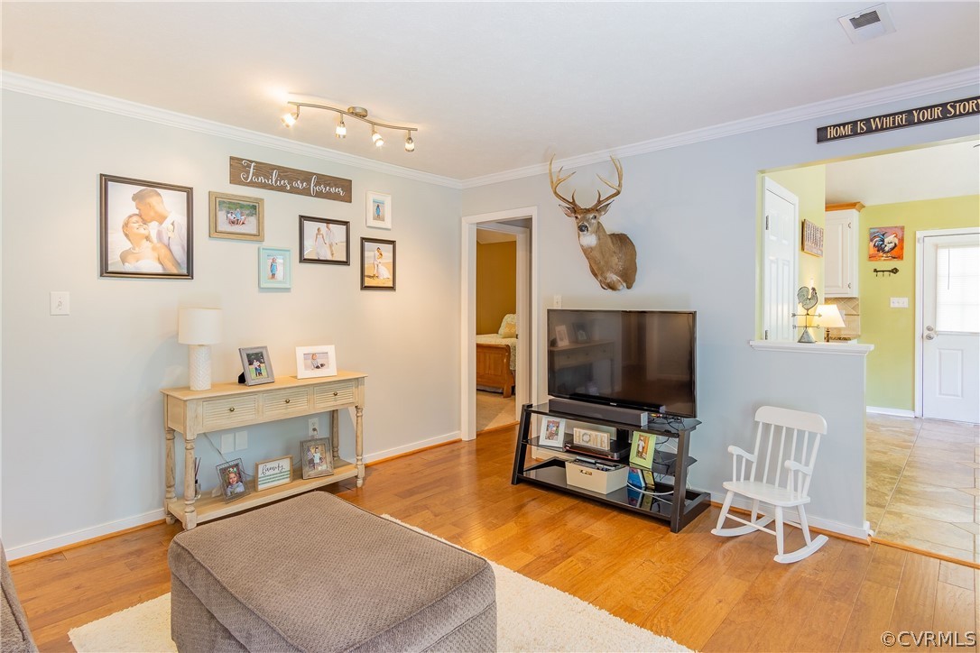 460 Rosebud Run Aylett, VA 23009 - Photo 11 of 32 a living room with furniture and a flat screen tv