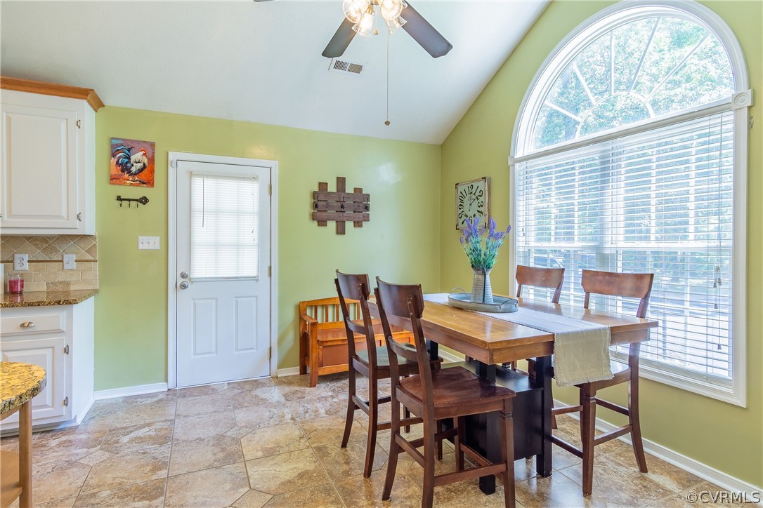 460 Rosebud Run Aylett, VA 23009 - Photo 12 of 32 a view of a dining room with furniture and a chandelier