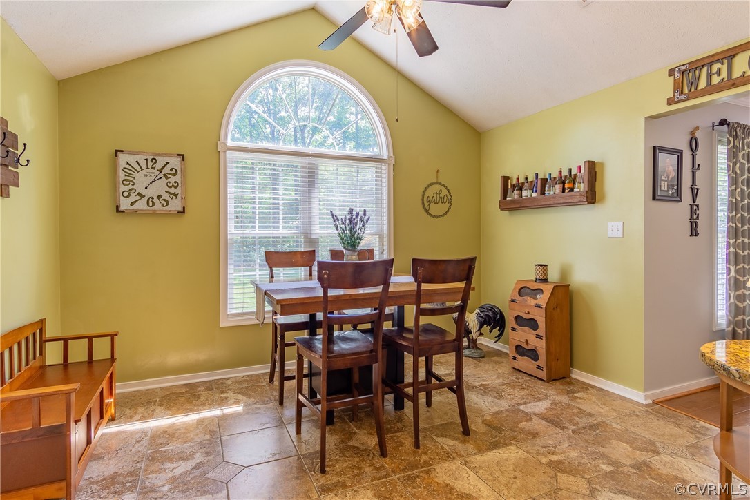 460 Rosebud Run Aylett, VA 23009 - Photo 15 of 32 a view of a dining room with furniture and a large window