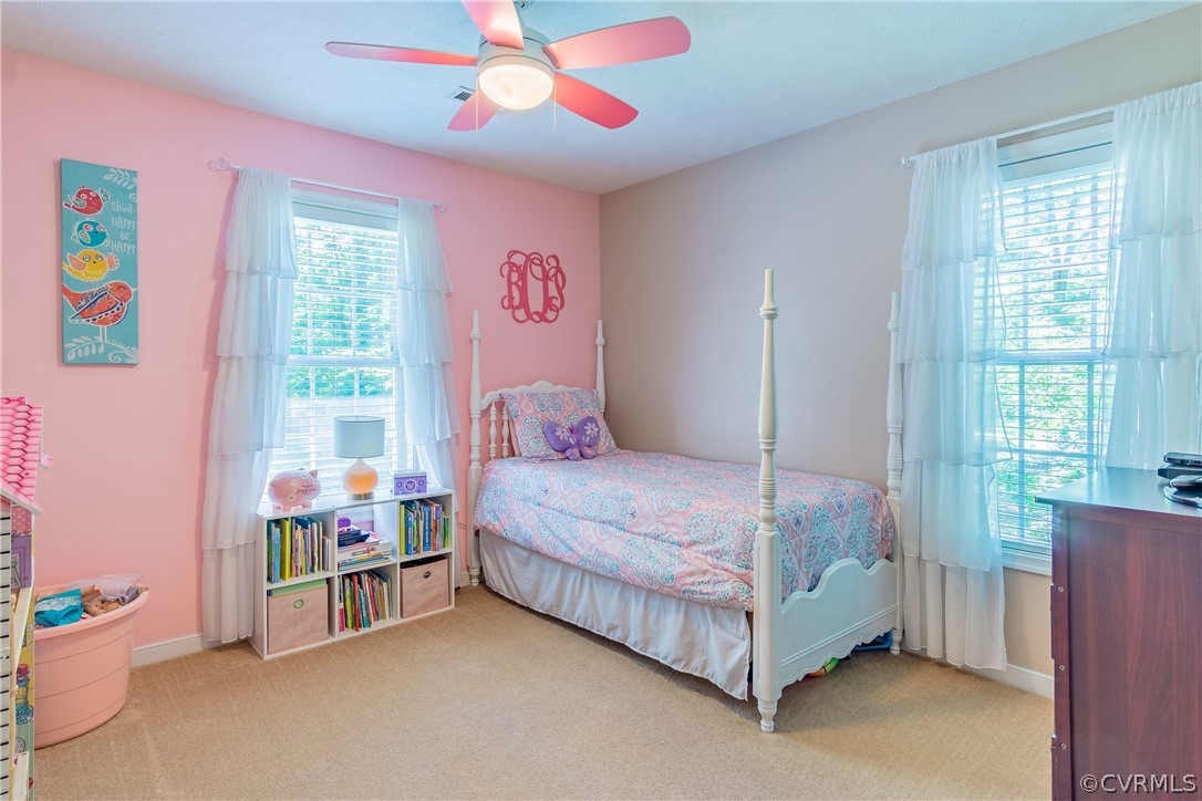 460 Rosebud Run Aylett, VA 23009 - Photo 21 of 32 a bedroom with a bed and a window