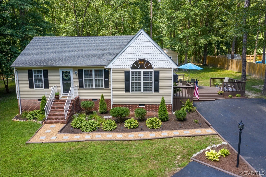 460 Rosebud Run Aylett, VA 23009 - Photo 29 of 32 a view of a white house with a big yard and potted plants