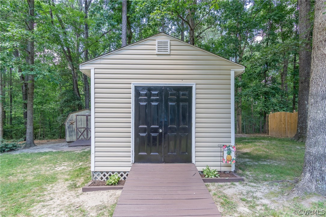 460 Rosebud Run Aylett, VA 23009 - Photo 32 of 32 a front view of a house with a garden