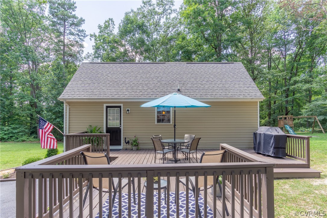 460 Rosebud Run Aylett, VA 23009 - Photo 4 of 32 a view of house with a deck and furniture