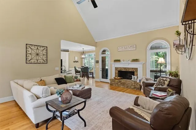 a kitchen with stainless steel appliances white cabinets and a window