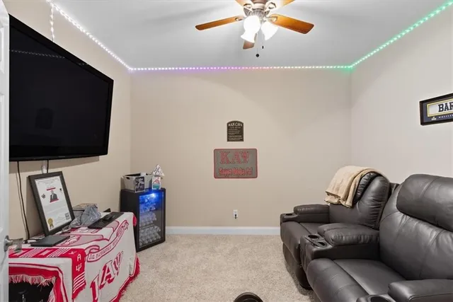 an aerial view of a house with a yard and swimming pool