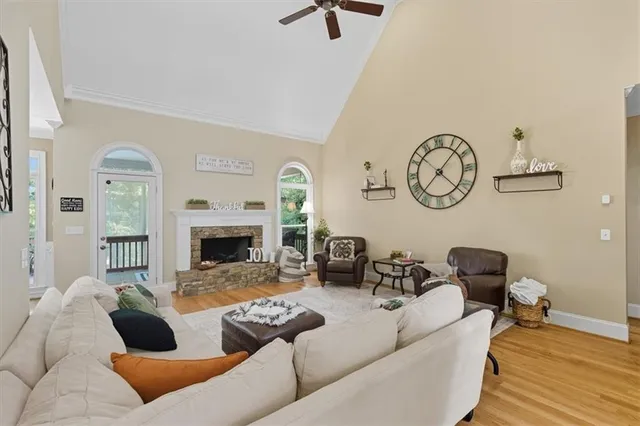 a living room with furniture a rug and a table