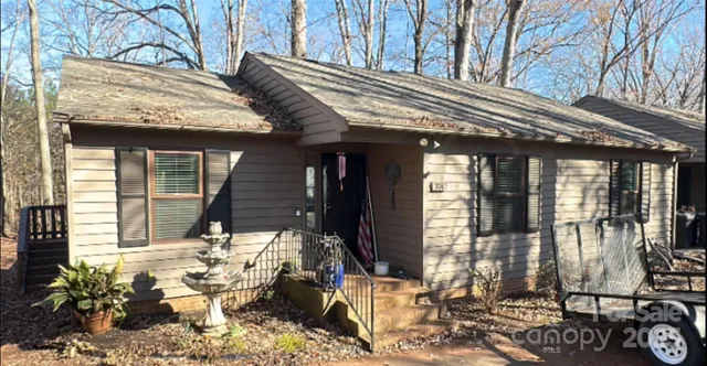 a view of house with outdoor seating