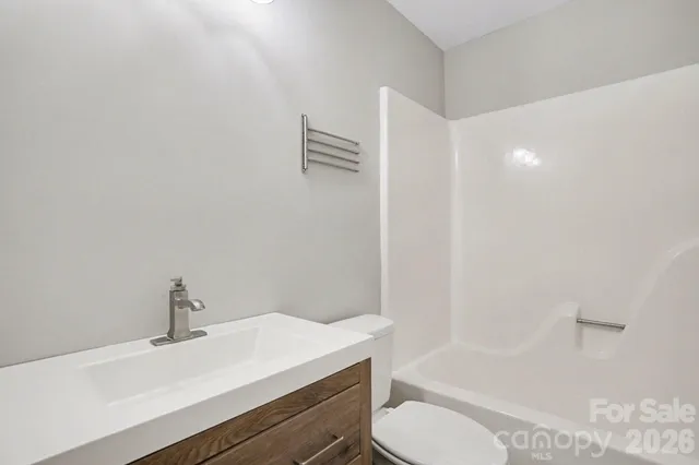 a bathroom with a sink toilet and bathtub