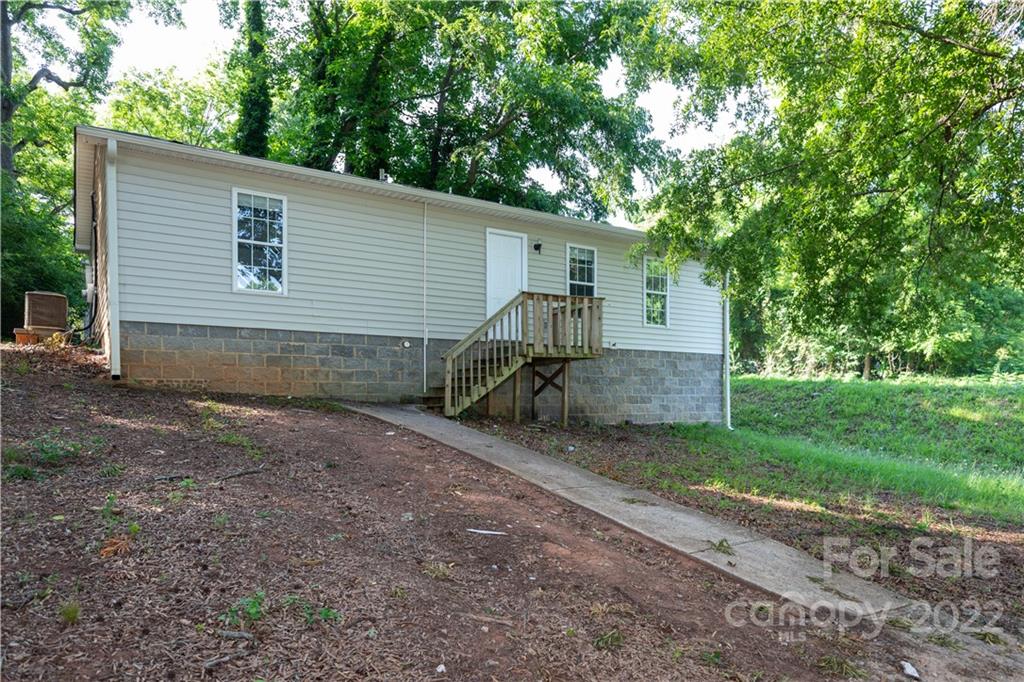 351 Haigler Street Rock Hill, SC 29732 - Photo 16 of 16 a view of backyard with plants and a large tree
