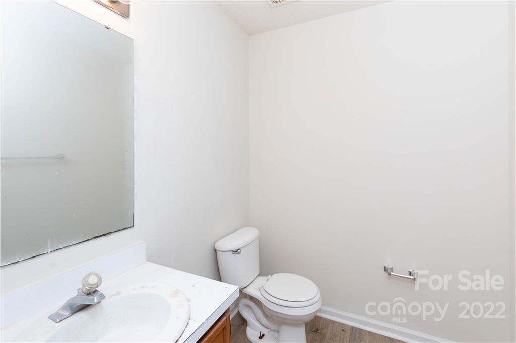 351 Haigler Street Rock Hill, SC 29732 - Photo 10 of 16 a bathroom with a sink a toilet and mirror