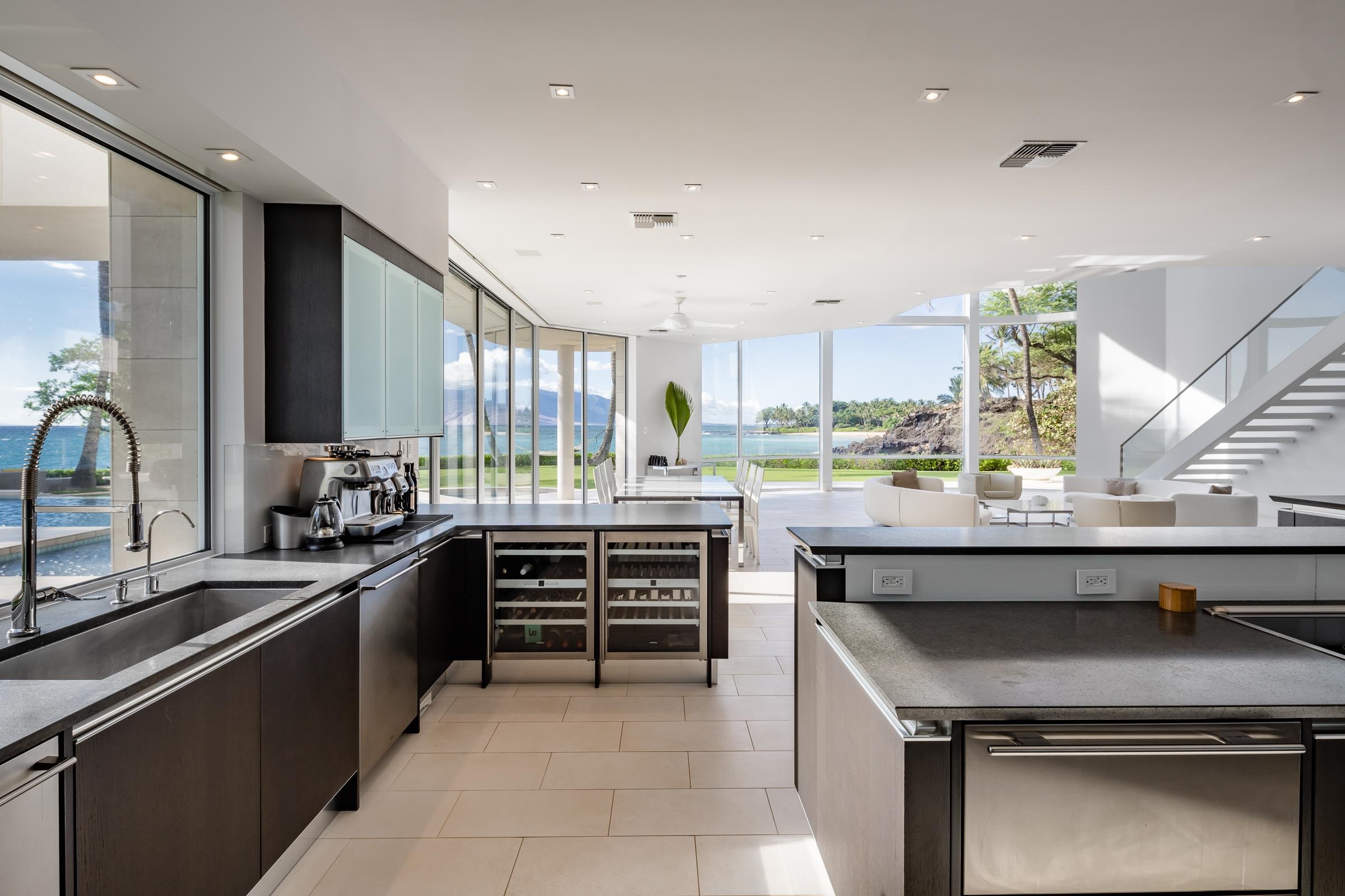 4572 Makena Road Kihei, HI 96753 - Photo 19 of 30 a kitchen with stainless steel appliances kitchen island granite countertop a sink and cabinets