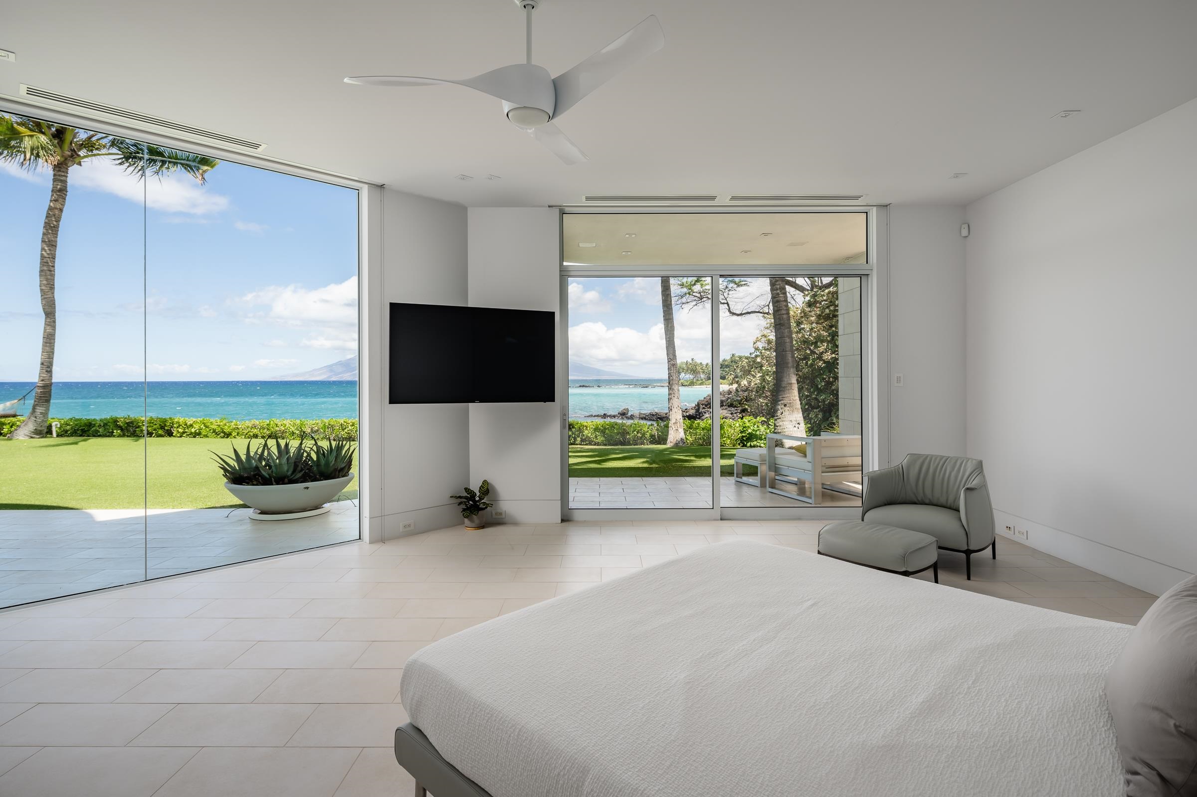 4572 Makena Road Kihei, HI 96753 - Photo 22 of 30 a living room with furniture and a flat screen tv