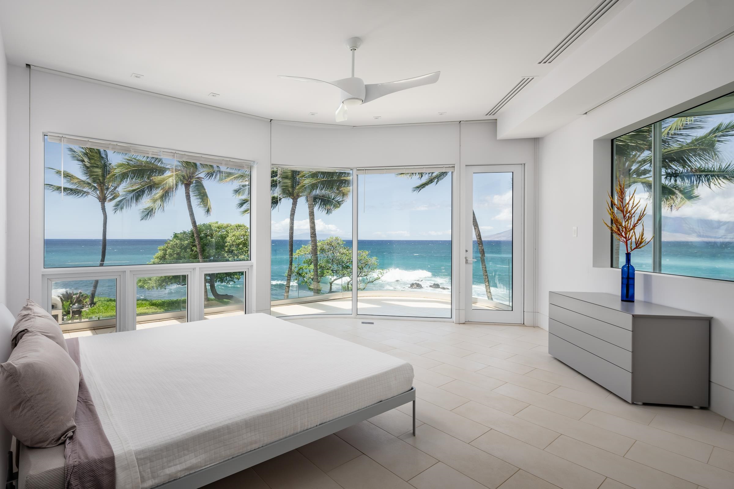 4572 Makena Road Kihei, HI 96753 - Photo 24 of 30 a bedroom with a bed and a large window