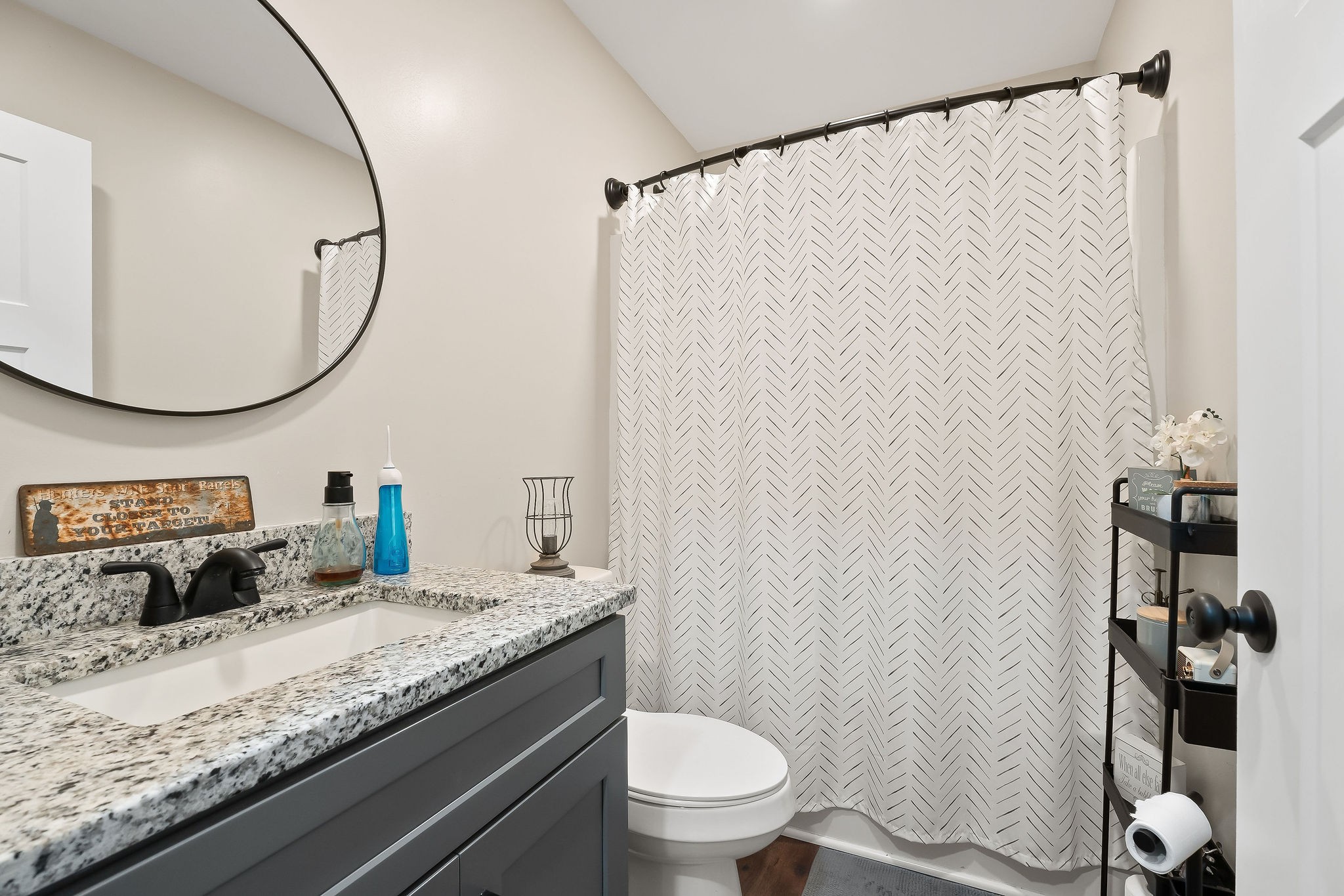 936 North Spring Street Sparta, TN 38583 - Photo 14 of 31 a bathroom with a granite countertop sink mirror vanity and toilet