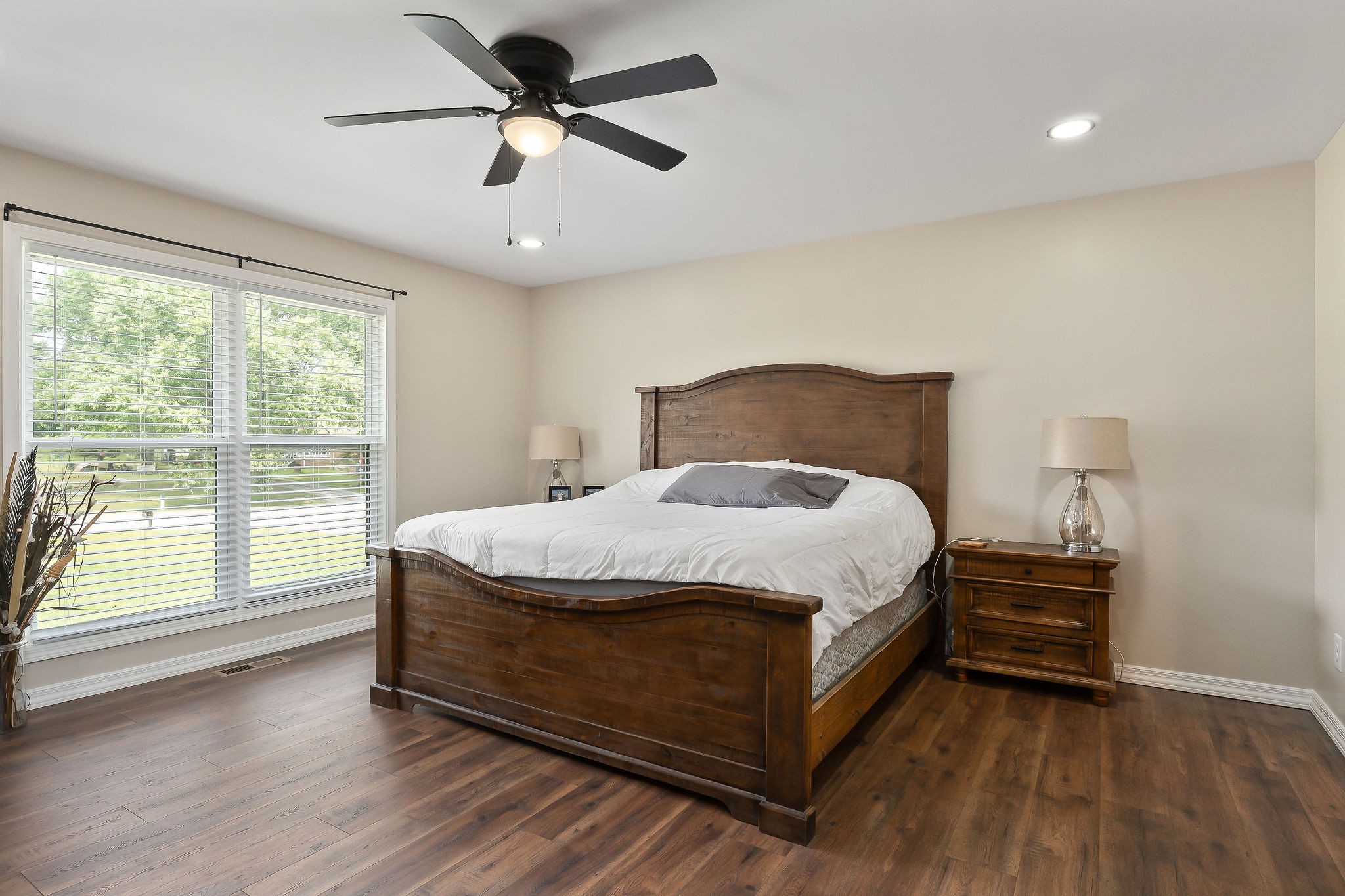 936 North Spring Street Sparta, TN 38583 - Photo 17 of 31 a bed sitting in a spacious bedroom next to a window