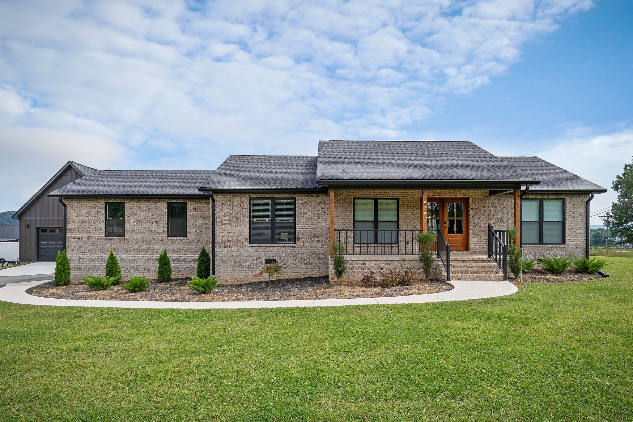 936 North Spring Street Sparta, TN 38583 - Photo 4 of 31 a front view of a house with a yard and porch