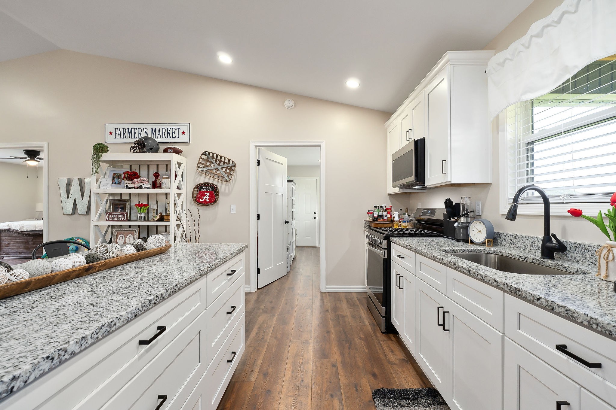 936 North Spring Street Sparta, TN 38583 - Photo 10 of 31 a large kitchen with stainless steel appliances granite countertop a lot of counter space and wooden floors