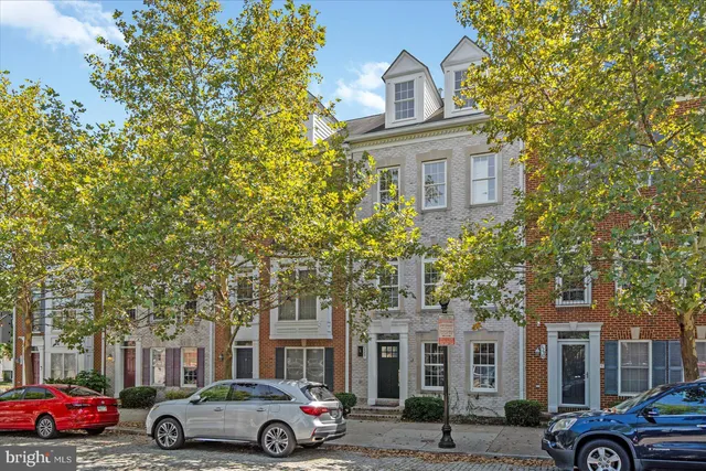 a front view of a building with parking space