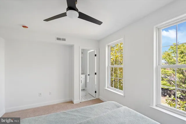 a bathroom with double vanity sink two mirror and a
