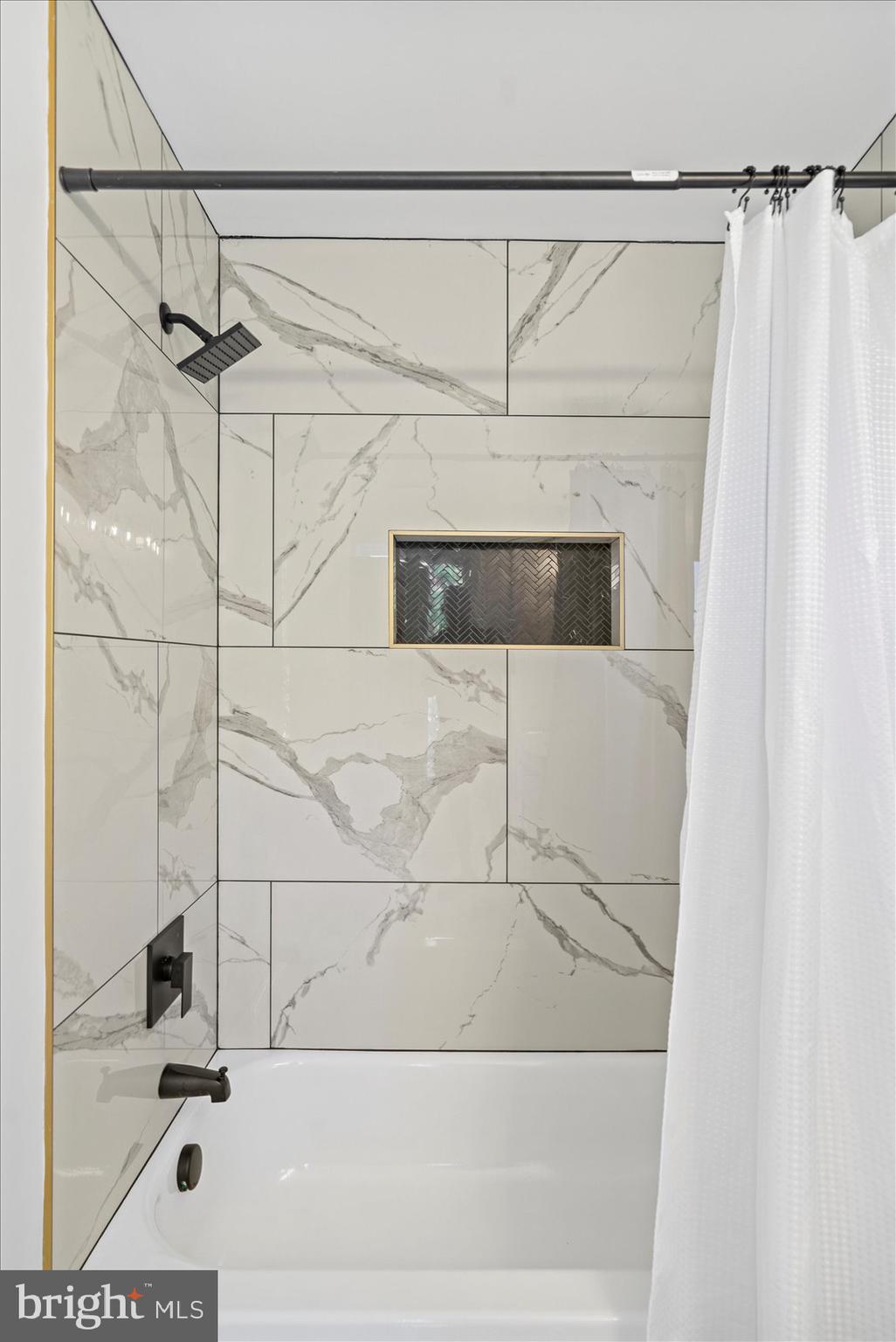 829 McHenry Street Baltimore, MD 21230 - Photo 31 of 41 a bathroom with a shower and a mirror