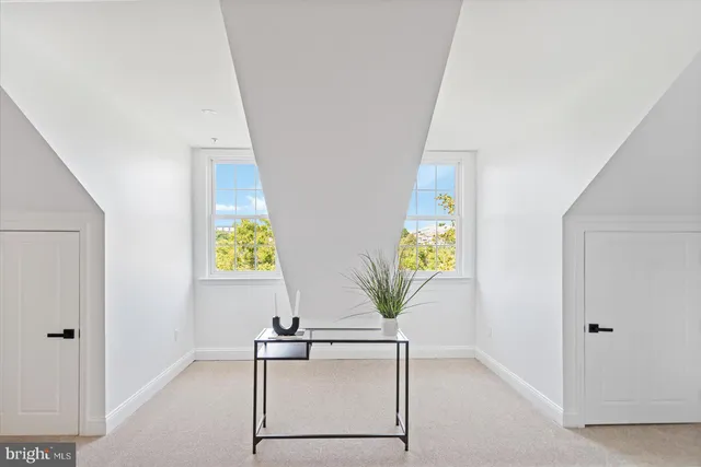 a bedroom with a bed and a table