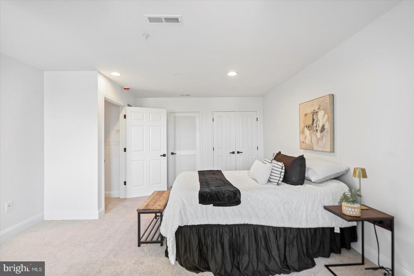 829 McHenry Street Baltimore, MD 21230 - Photo 40 of 41 a bedroom with a bed and a table