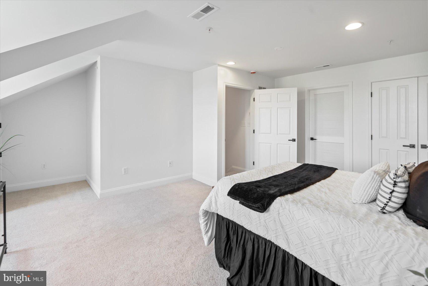 829 McHenry Street Baltimore, MD 21230 - Photo 41 of 41 a bedroom with a bed and a cabinets