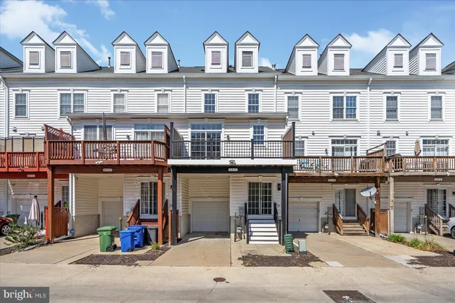 a front view of a building with many windows