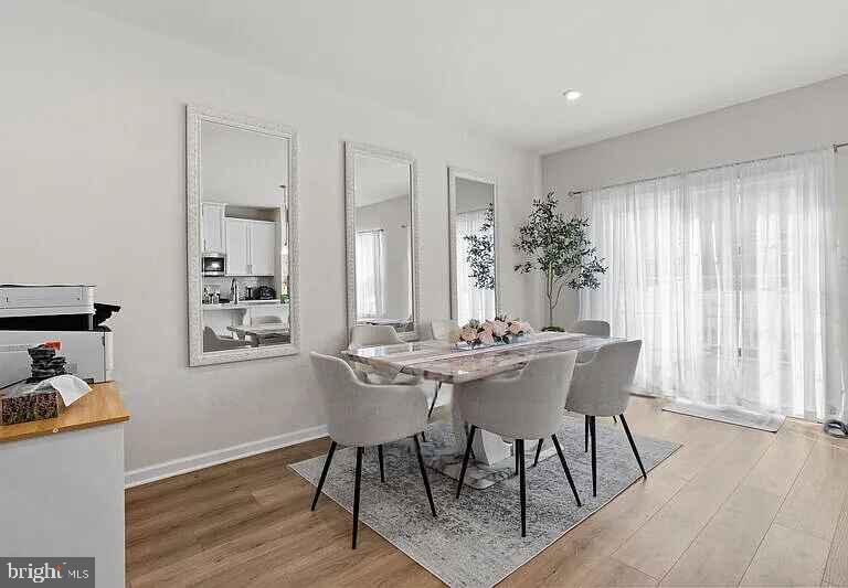 31 Continental Boulevard Sicklerville, NJ 08081 - Photo 18 of 29 a view of a dining room with furniture and wooden floor