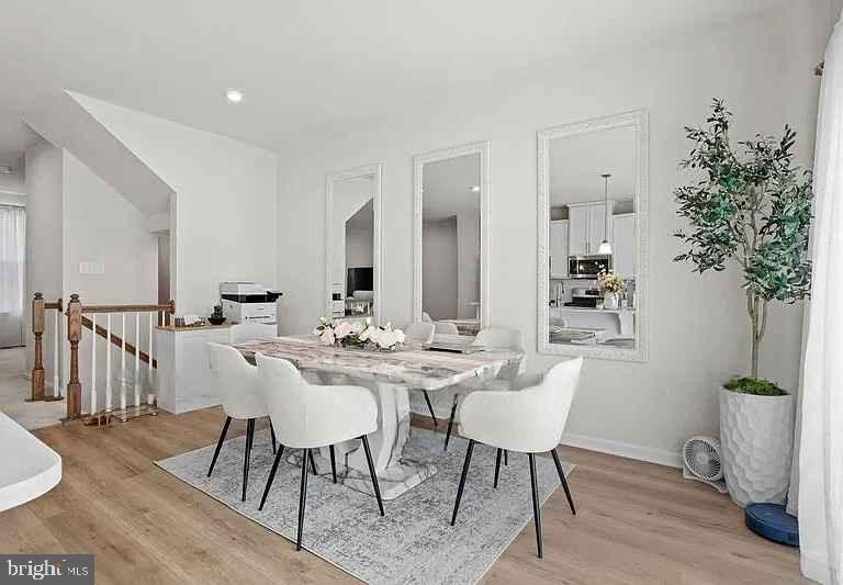 31 Continental Boulevard Sicklerville, NJ 08081 - Photo 19 of 29 a view of a dining room with furniture and wooden floor