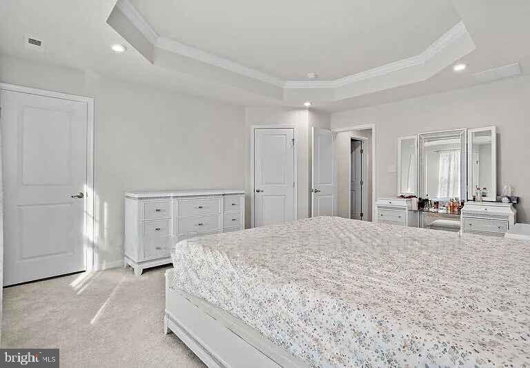 31 Continental Boulevard Sicklerville, NJ 08081 - Photo 23 of 29 a spacious bedroom with a large bed and a chandelier