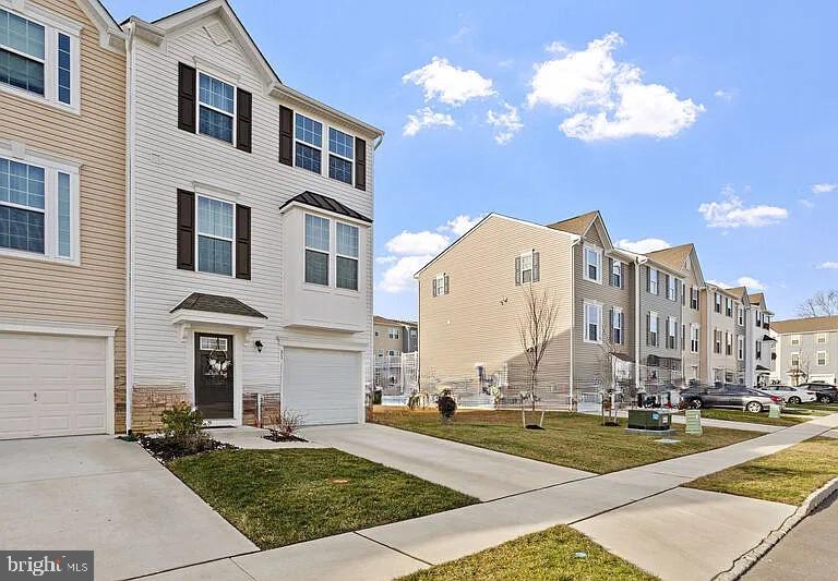31 Continental Boulevard Sicklerville, NJ 08081 - Photo 3 of 29 a view of a building with a yard
