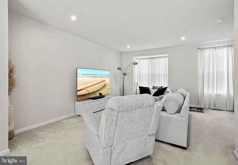31 Continental Boulevard Sicklerville, NJ 08081 - Photo 9 of 29 a living room with furniture window and flat screen tv