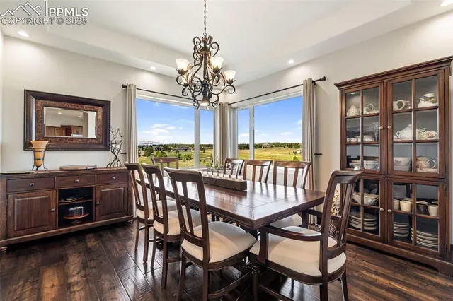 a view of a dining room with furniture window and wooden floor