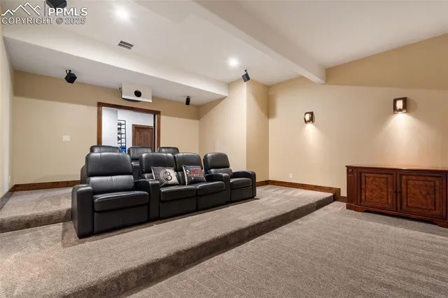 a living room with a couch and a dresser with wooden floor