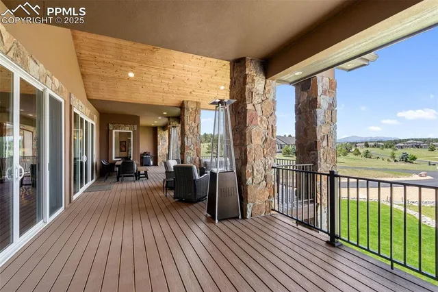 a view of a balcony with wooden floor