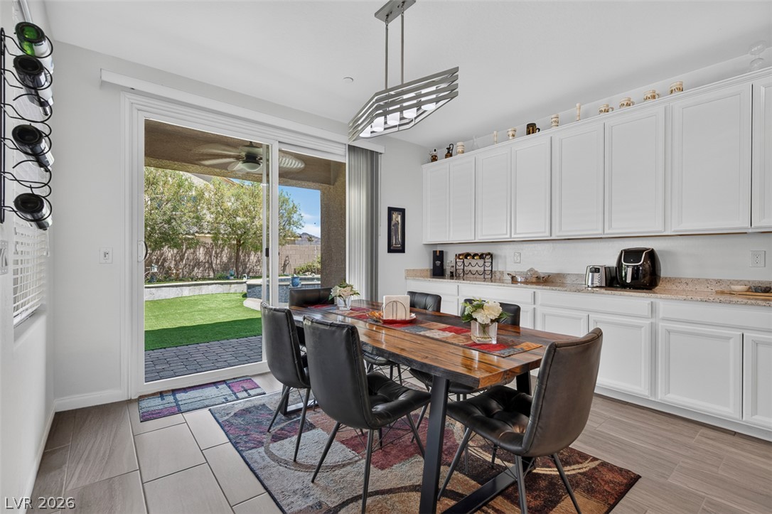 1824 Redland Ridge Street Henderson, NV 89002 - Photo 13 of 69 Dine alfresco with seamless access to a private yard from this inviting dining area.