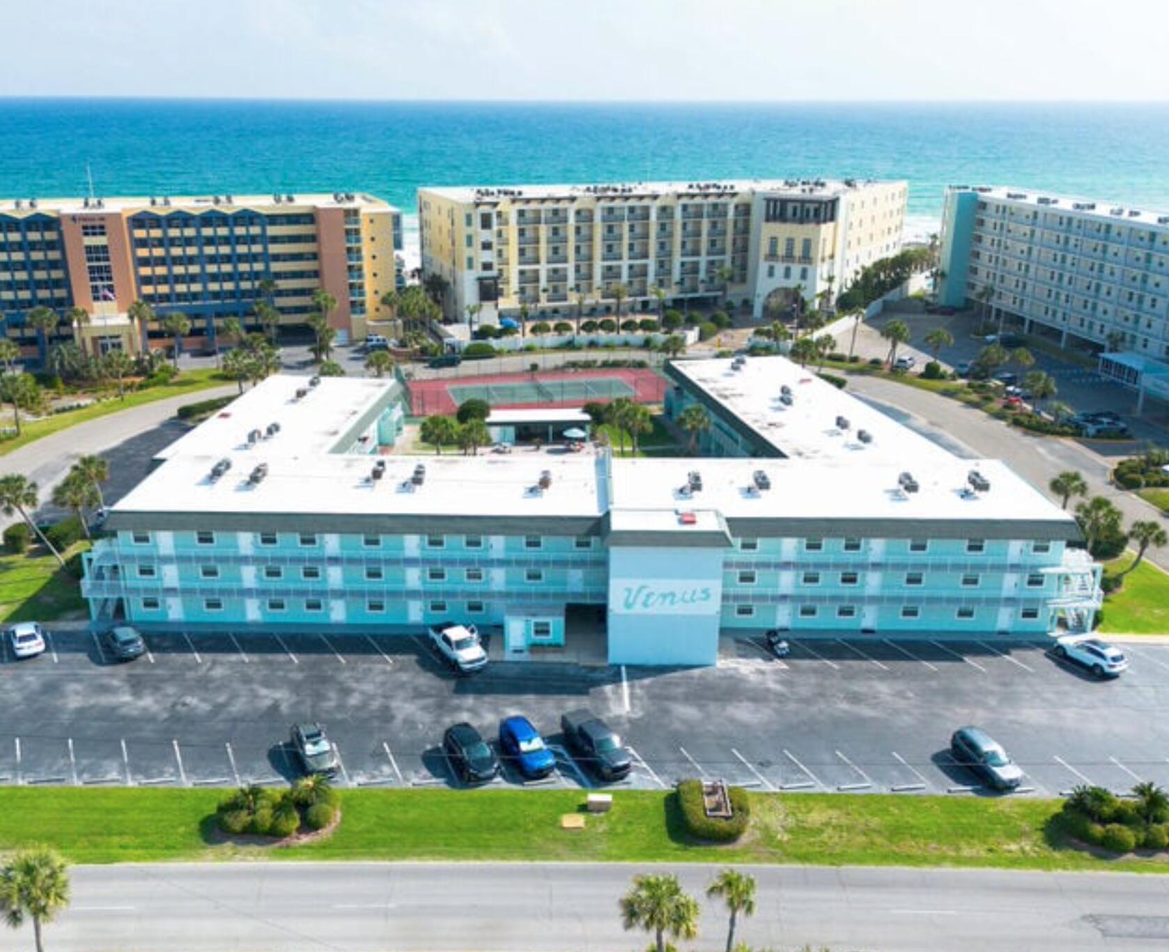 an aerial view of a building with outdoor space
