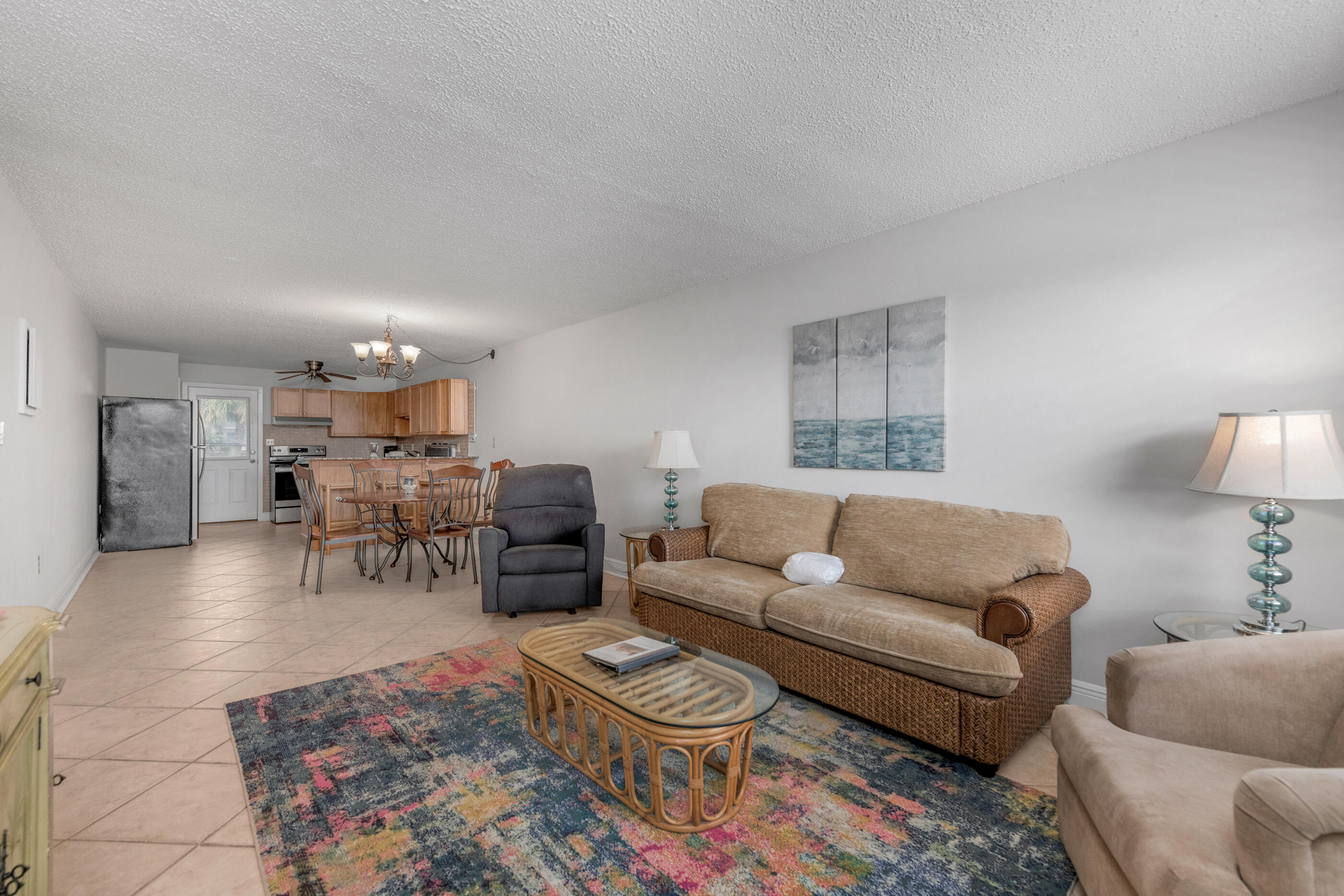 885 Santa Rosa Boulevard, Unit 208 Fort Walton Beach, FL 32548 - Photo 7 of 15 a living room with furniture and a rug