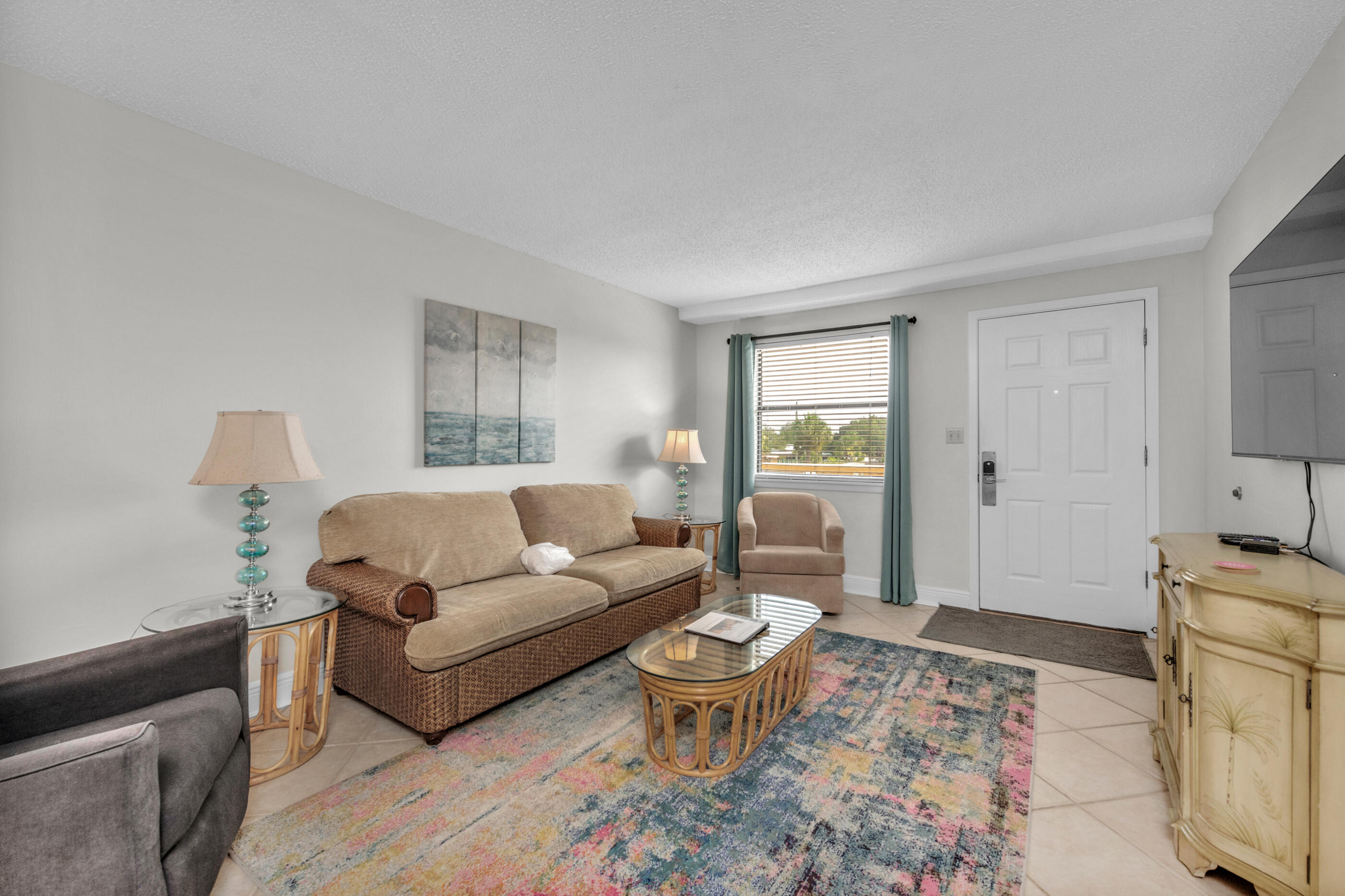885 Santa Rosa Boulevard, Unit 208 Fort Walton Beach, FL 32548 - Photo 8 of 15 a living room with furniture and a window