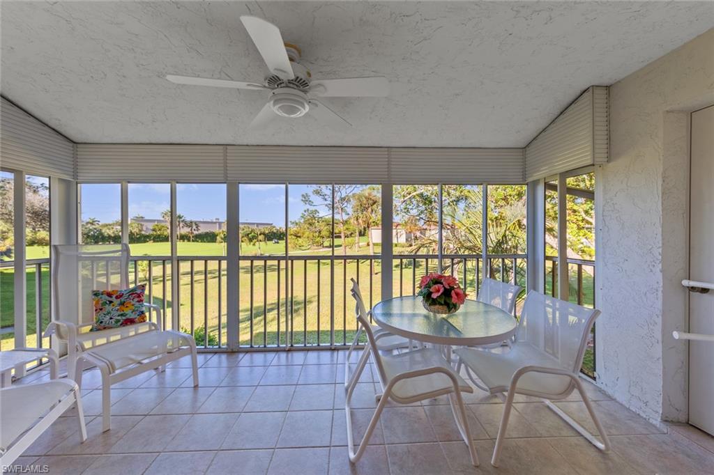 273 Albi Road, Unit 4 Naples, FL 34112 - Photo 21 of 50 Unfurnished sunroom with ceiling fan